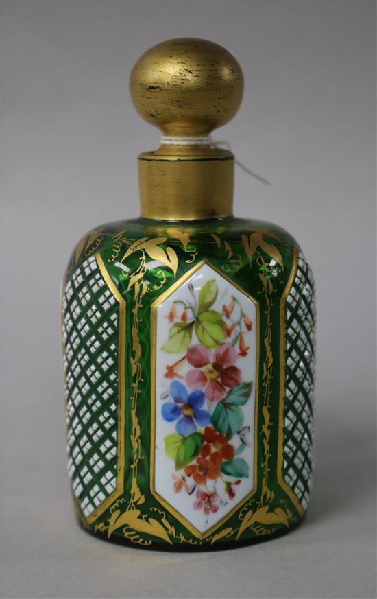 A 19th century green glass and enamelled scent bottle